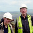 Ironworks Project staff pose for a photo at the remains of Crawshawy's Tower