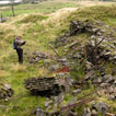 A GGAT archaeologist recording the remains of structures at Tower Graig Level